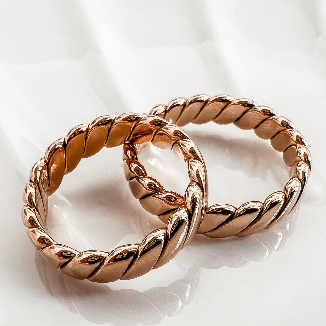 Couple of Golden Rings on White Background